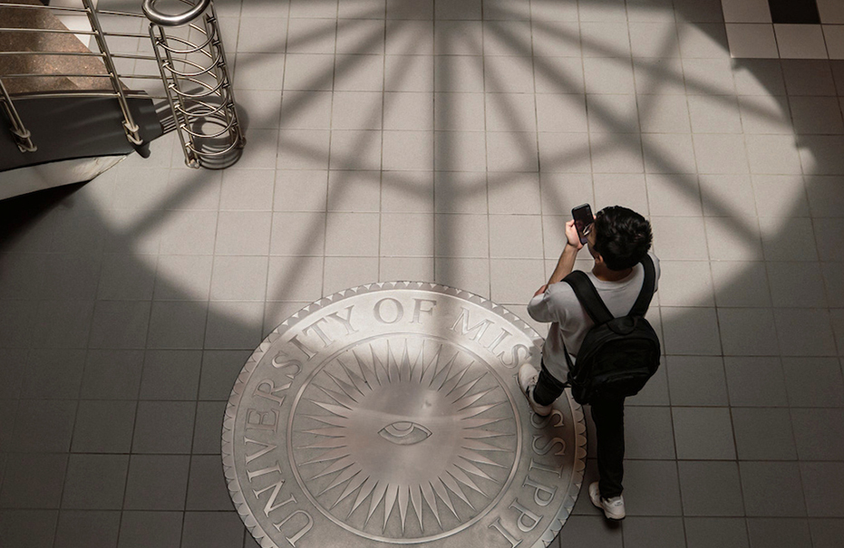 Student walking through a building